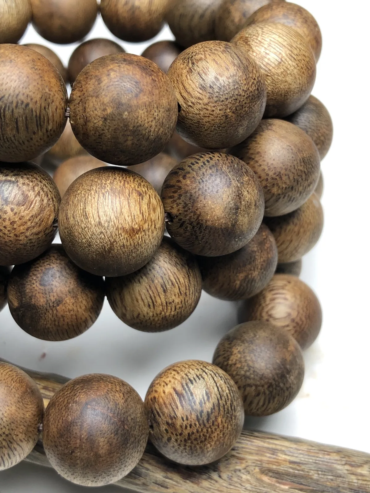 Do agarwood beads smell more when round? A round bead close-up