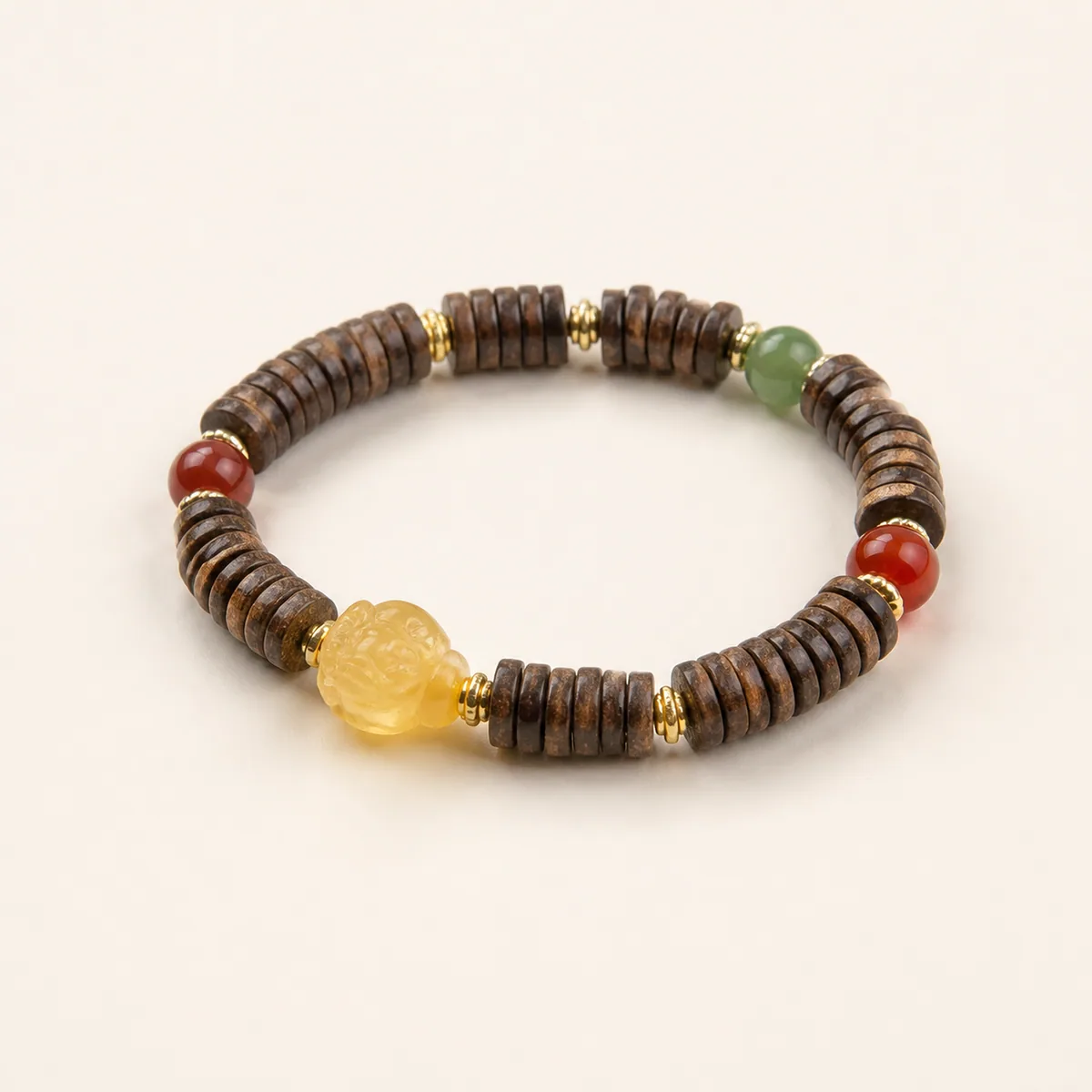 Amber bracelet with agarwood disc beads and a carved beeswax amber centre